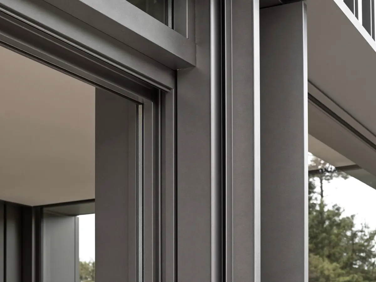 Slim anthracite grey aluminium window frame on a contemporary home